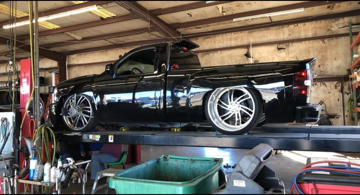 Black truck in shop